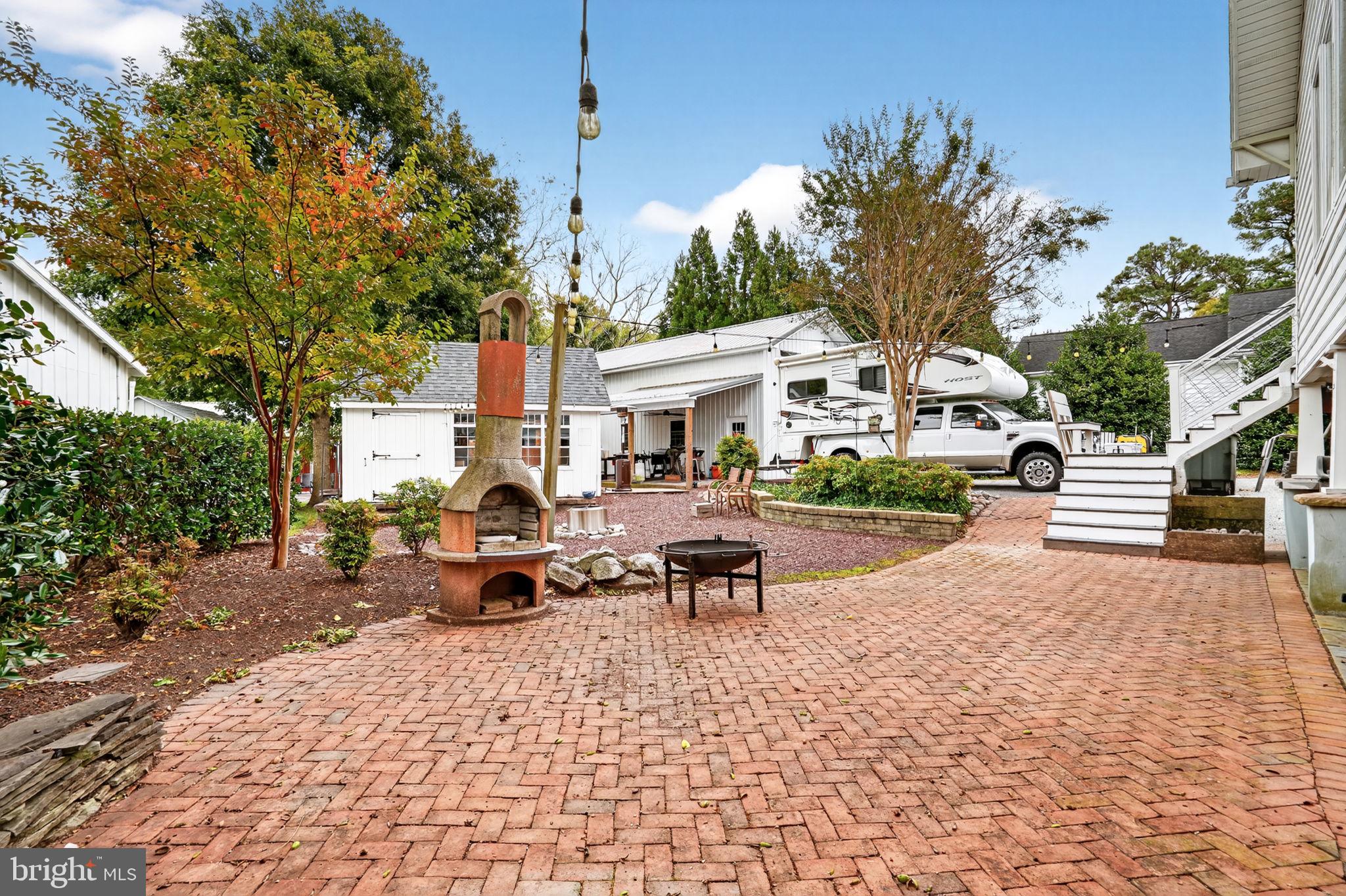 501 South Main Street Berlin, MD 21811 - Photo 70 of 75 a view of a house with backyard porch and sitting area