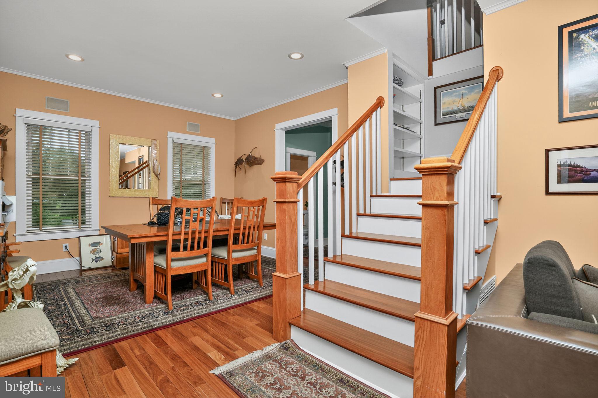 501 South Main Street Berlin, MD 21811 - Photo 7 of 75 a dining room with wooden floor and furniture