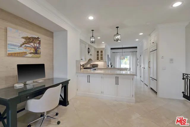 a view of kitchen with workspace and window