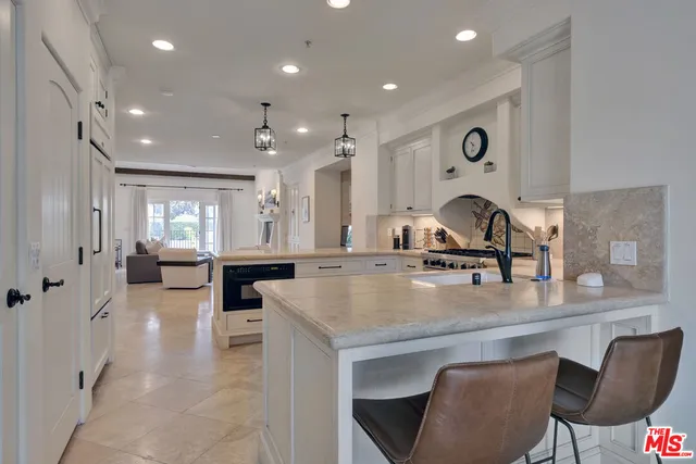 a view of kitchen island with stainless steel appliances kitchen island