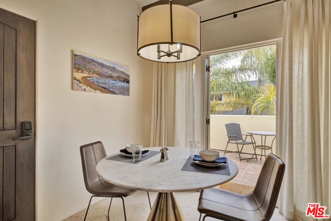 211 Bath Street Santa Barbara, CA 93101 - Photo 18 of 25 a view of a dining room with furniture window and outside view