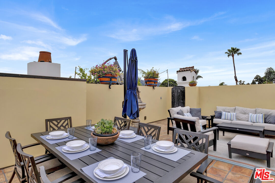 211 Bath Street Santa Barbara, CA 93101 - Photo 22 of 25 a view of a balcony with furniture and potted plants