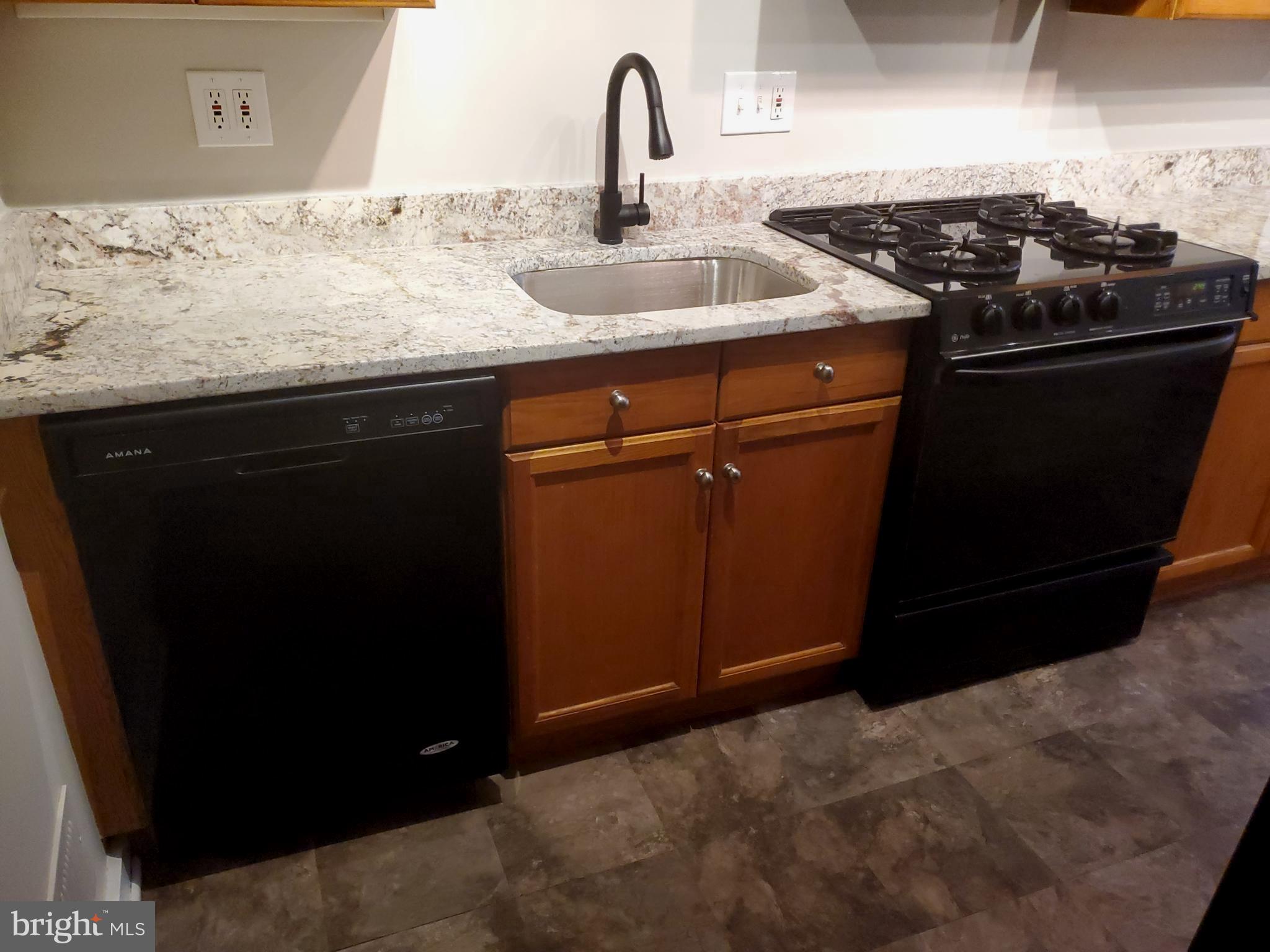 1014 Clayton Road Wilmington, DE 19805 - Photo 8 of 25 Dishwasher/Gas Stove/New Faucet/Updated floor