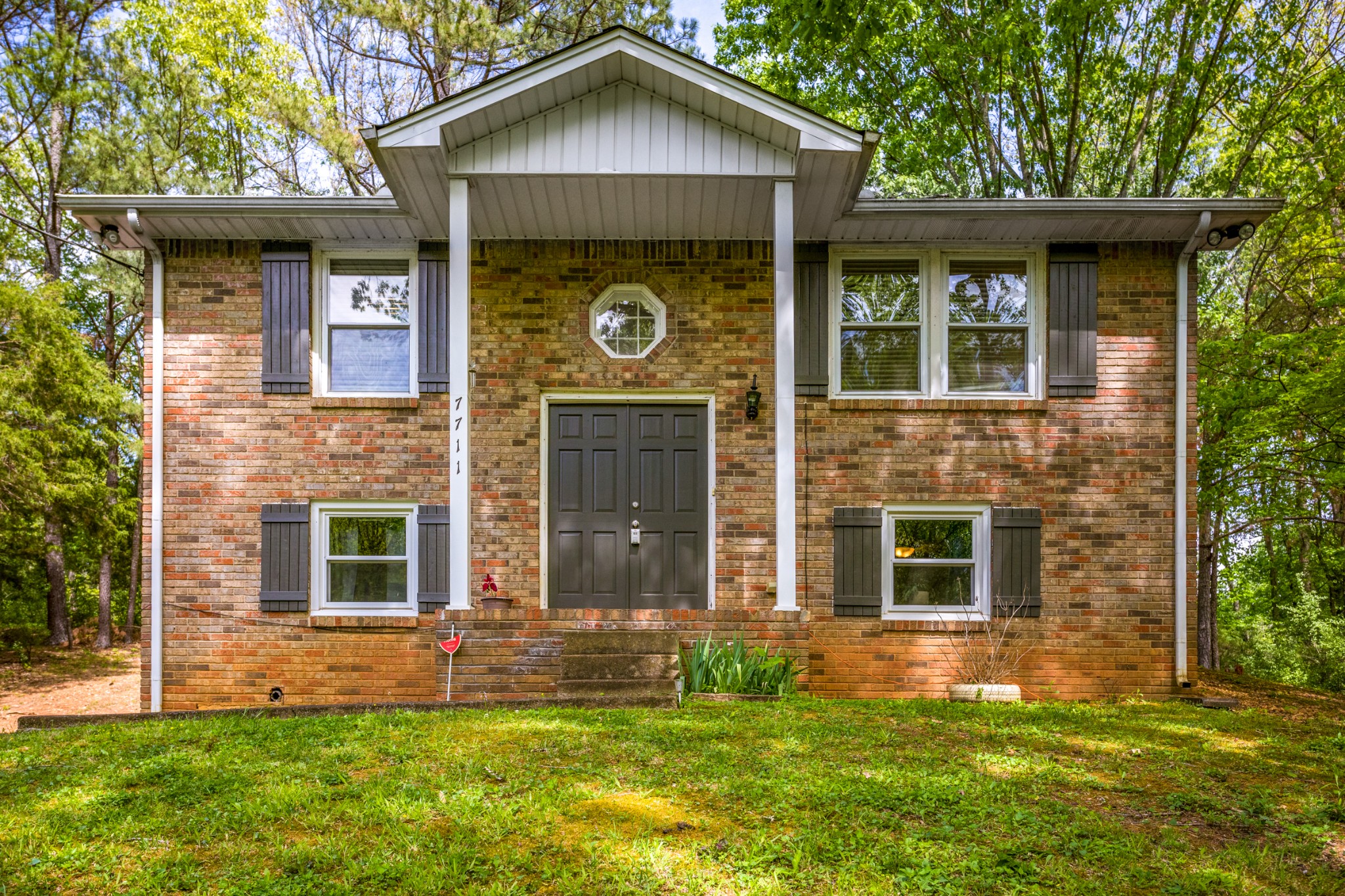 7711 Chester Road Fairview, TN 37062 - Photo 1 of 21 a front view of a house with a yard