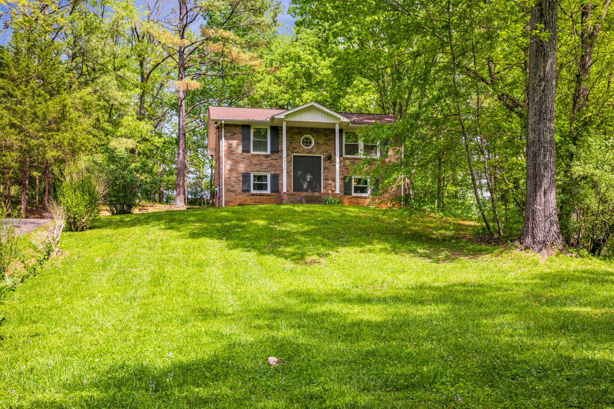 7711 Chester Road Fairview, TN 37062 - Photo 2 of 21 a front view of a house with a yard