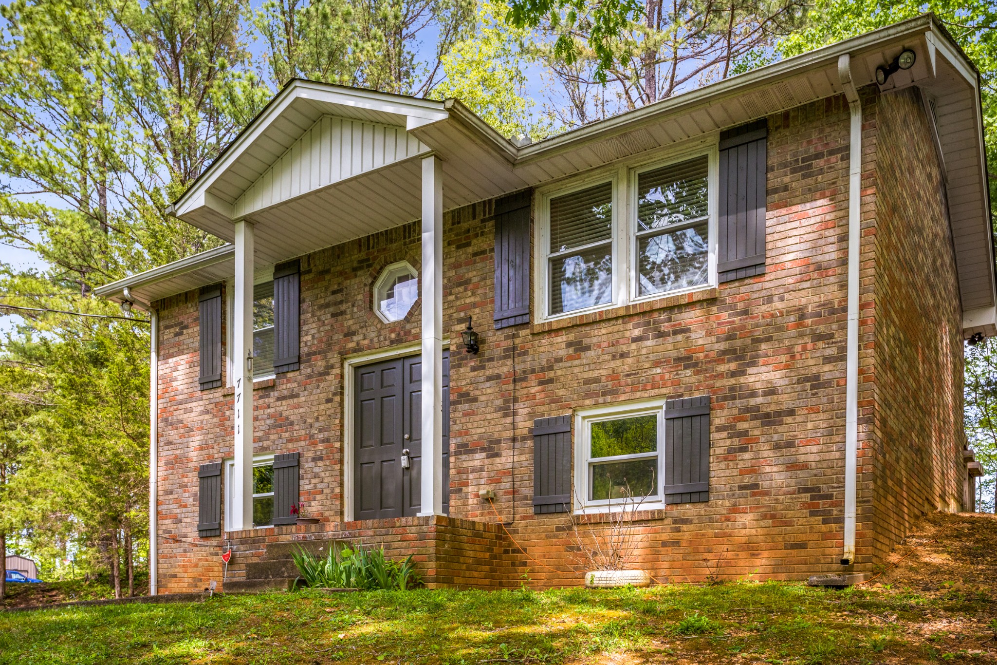 7711 Chester Road Fairview, TN 37062 - Photo 3 of 21 front view of a brick house with a yard