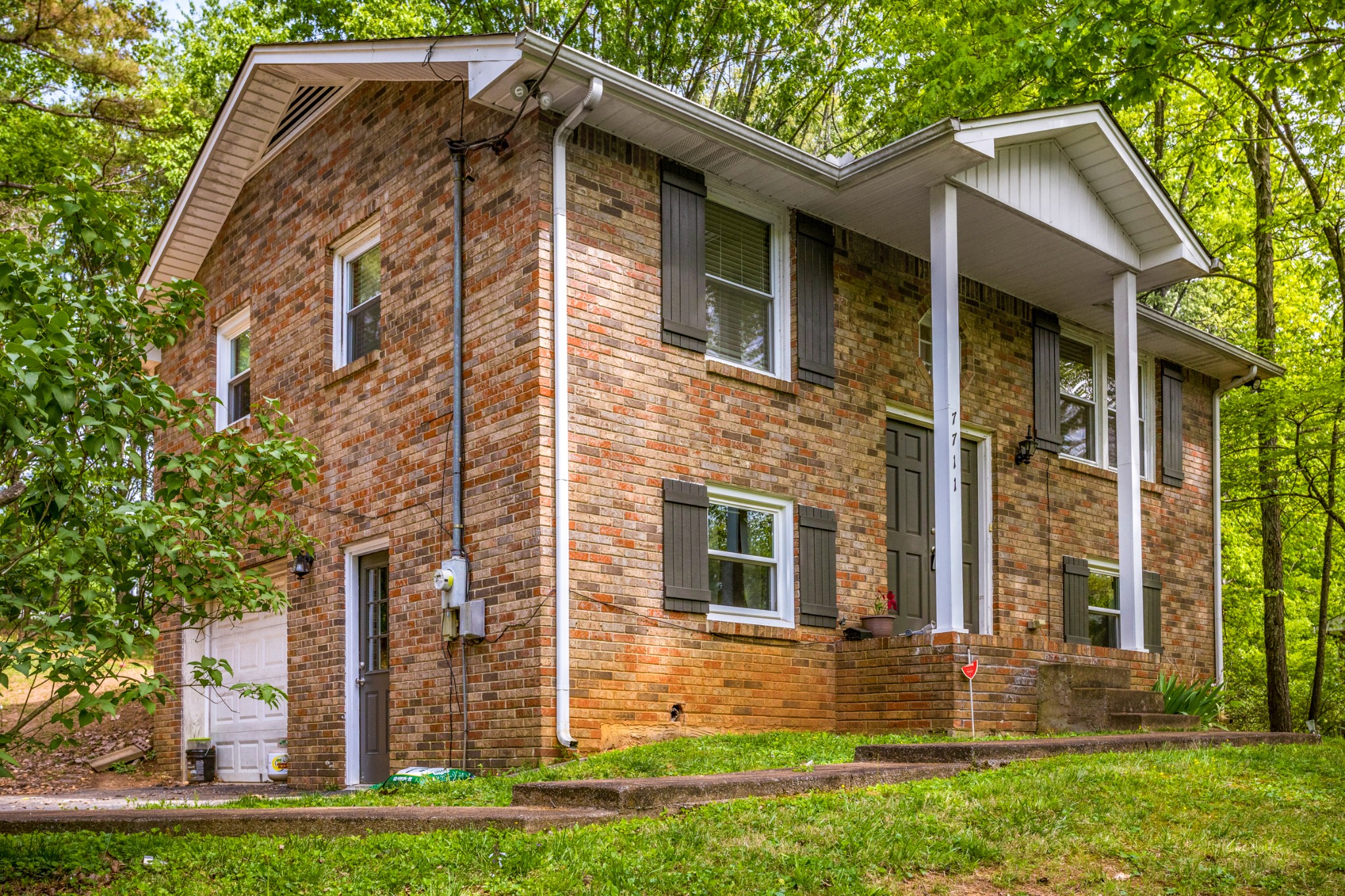 7711 Chester Road Fairview, TN 37062 - Photo 4 of 21 a front view of a house with garden
