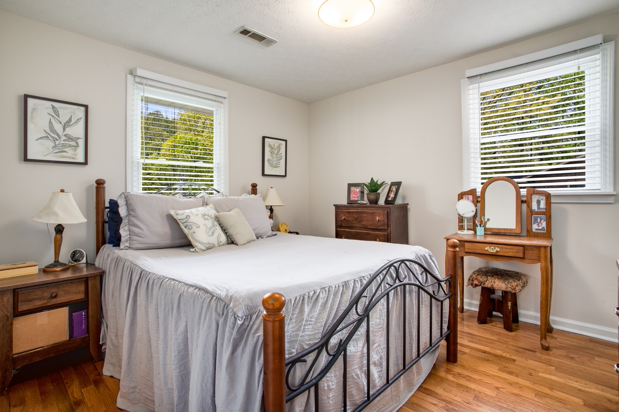 7711 Chester Road Fairview, TN 37062 - Photo 9 of 21 a bedroom with a bed and wooden floor