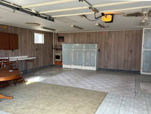 a view of an empty room and bathroom