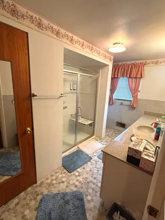 a bedroom with a bed and a dresser in it
