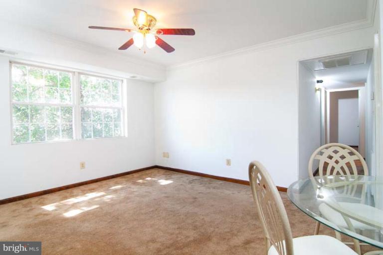 200 43rd Road Northeast, Unit 203 Washington, DC 20019 - Photo 2 of 13 Living Room / Dining Room with Hallway to Bedrooms
