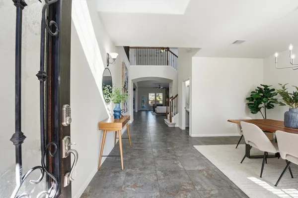 a view of a hallway with seating area