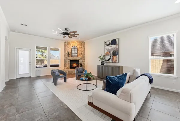 a spacious en suite bathroom with a double vanity sink a mirror and a shower