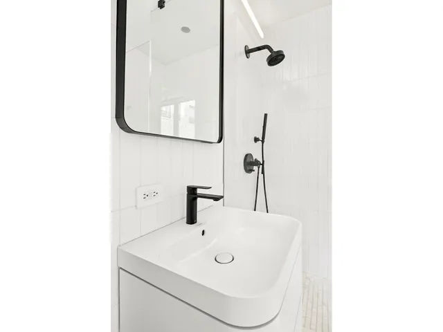 a bathroom with a sink and mirror