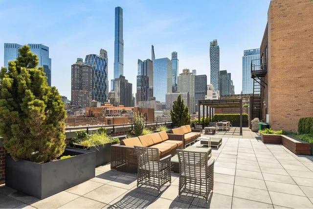 a view of a terrace with furniture