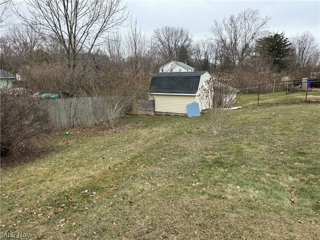 3153 Polly Road Ravenna, OH 44266 - Photo 6 of 8 Fenced backyard with a shed
