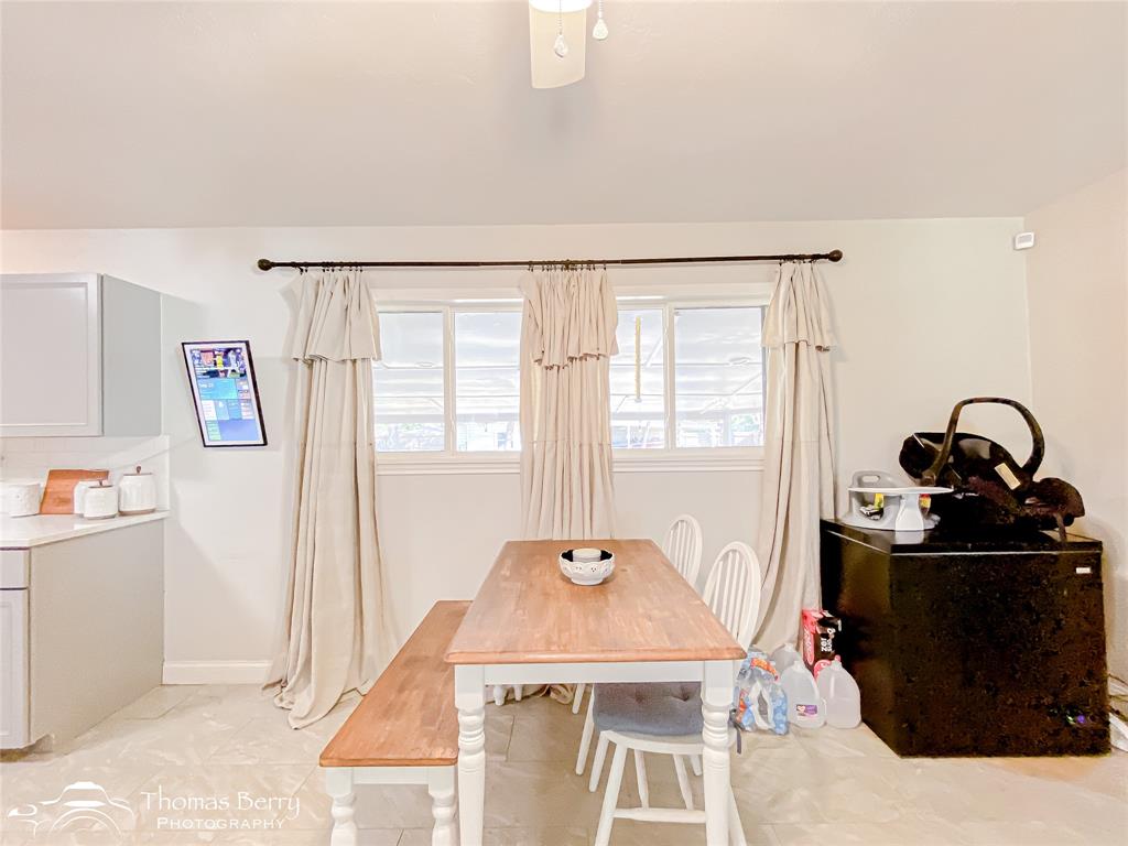 1502 Sunset Street Merkel, TX 79536 - Photo 13 of 35 a dining room with a table and chairs