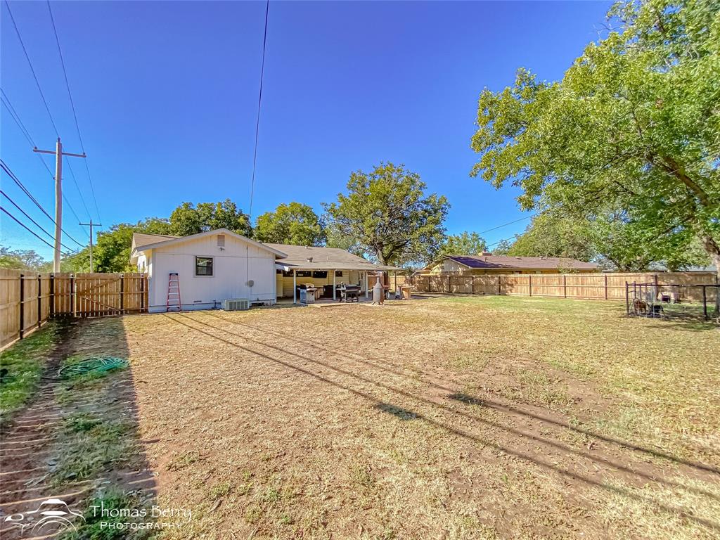 1502 Sunset Street Merkel, TX 79536 - Photo 31 of 35 a view of a house with a yard and sitting area