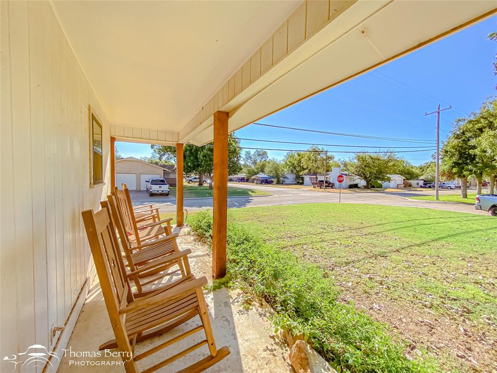 1502 Sunset Street Merkel, TX 79536 - Photo 6 of 35 a view of chairs and fire pit in front of yard