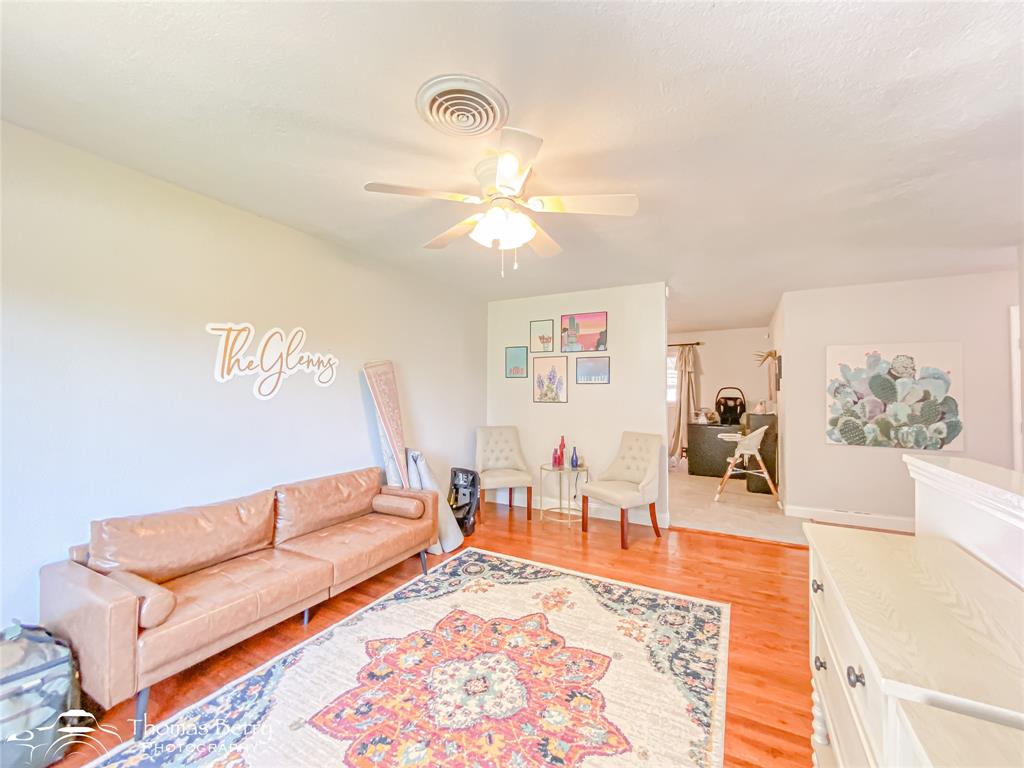 1502 Sunset Street Merkel, TX 79536 - Photo 9 of 35 a living room with furniture and a rug