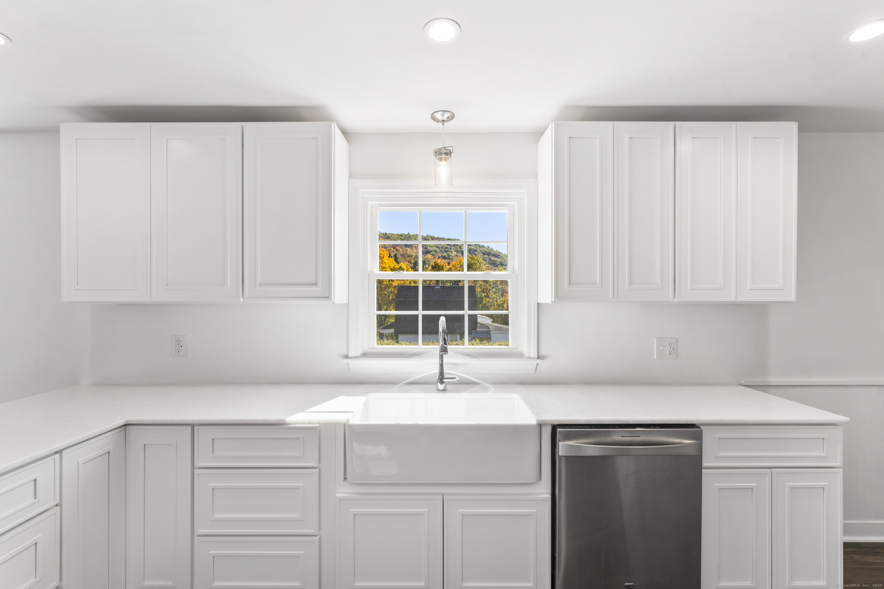 92 Feldspar Avenue Beacon Falls, CT 06403 - Photo 11 of 32 a kitchen with granite countertop a sink cabinets and window