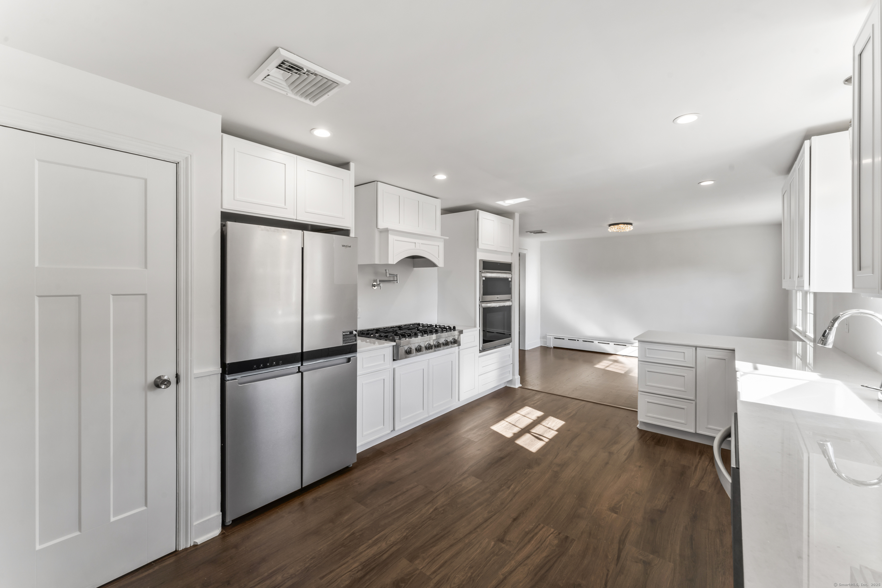 92 Feldspar Avenue Beacon Falls, CT 06403 - Photo 12 of 32 a kitchen with a refrigerator and a stove top oven