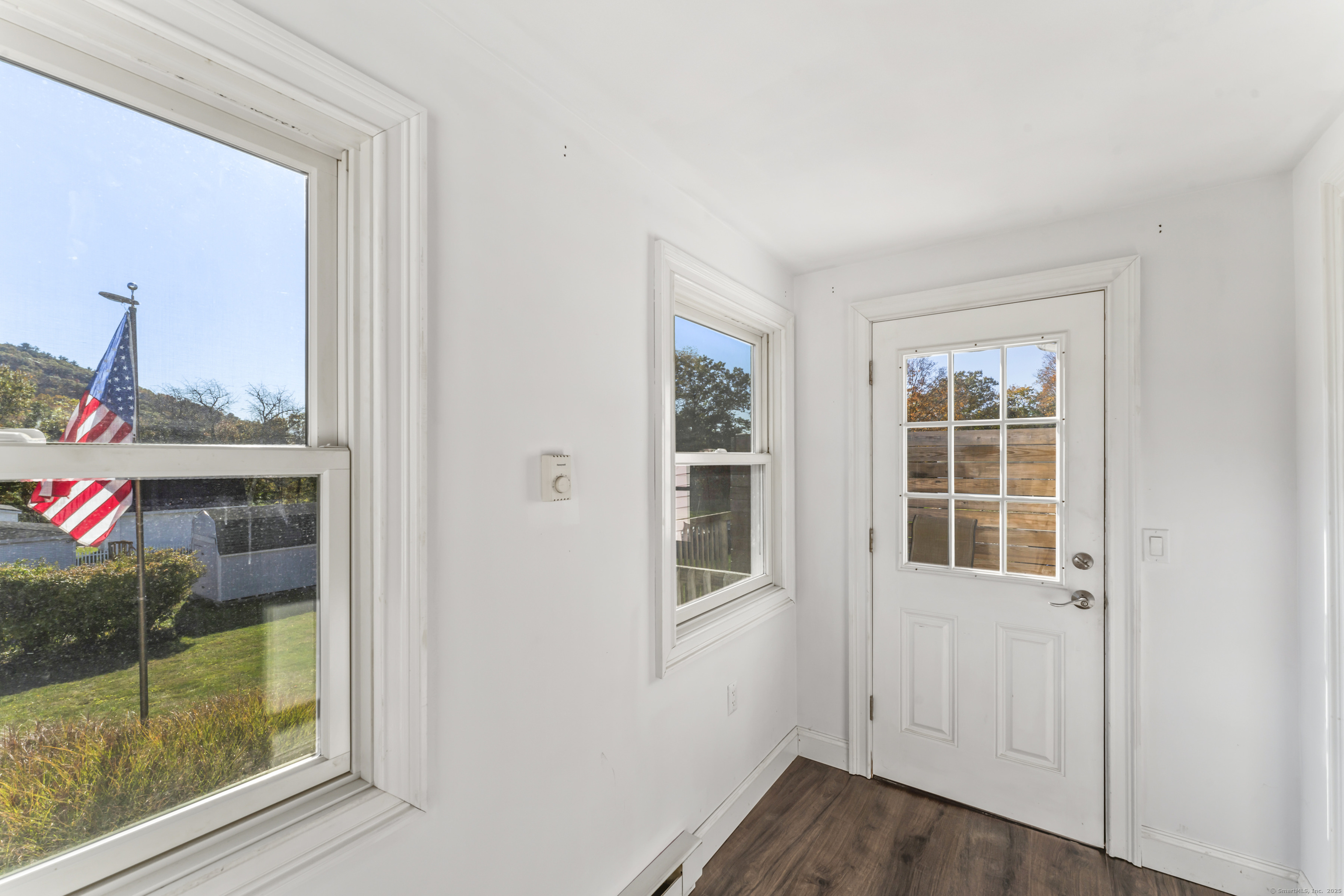92 Feldspar Avenue Beacon Falls, CT 06403 - Photo 13 of 32 a view of empty room with wooden floor and fan