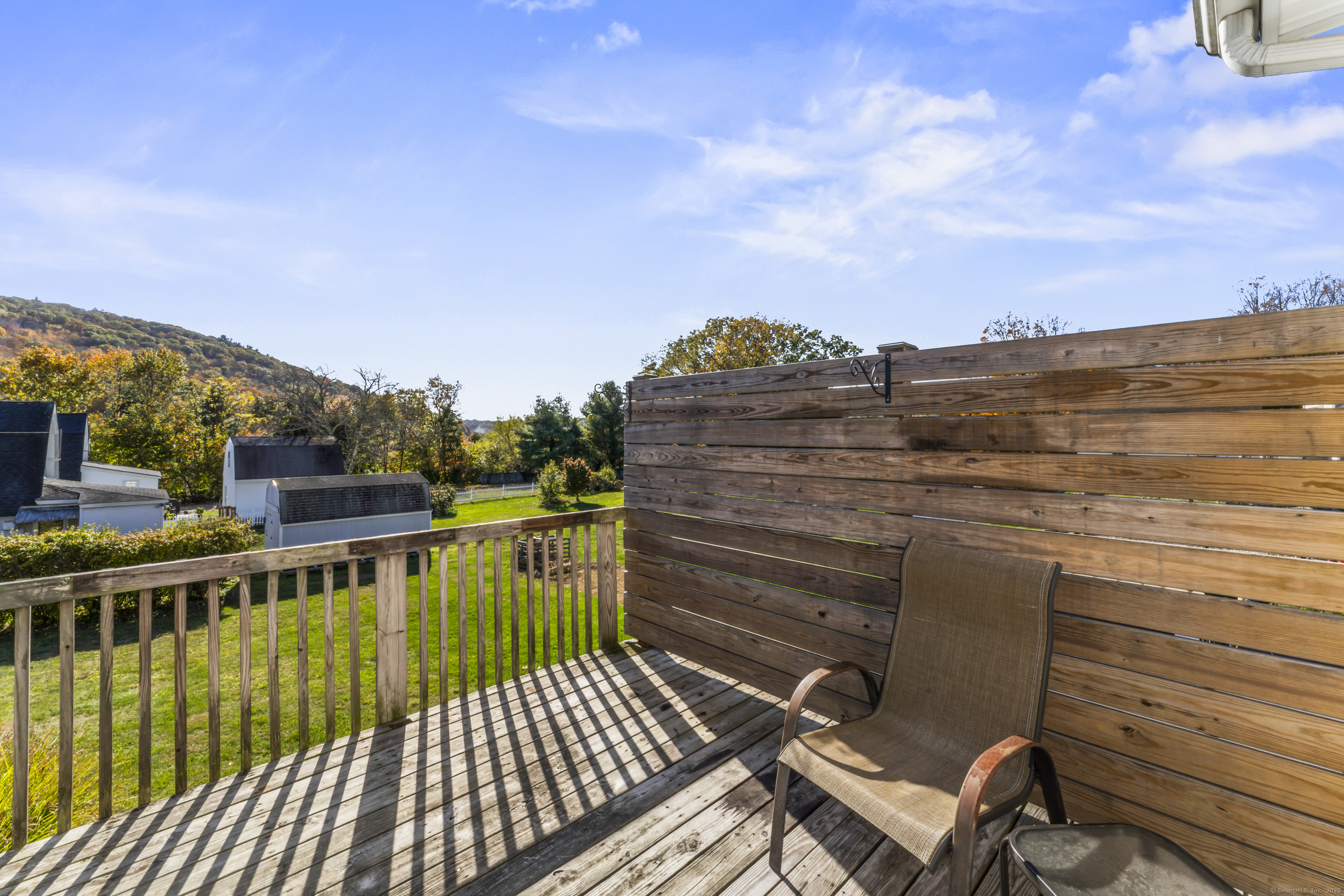 92 Feldspar Avenue Beacon Falls, CT 06403 - Photo 14 of 32 a view of a balcony with wooden floor and city view