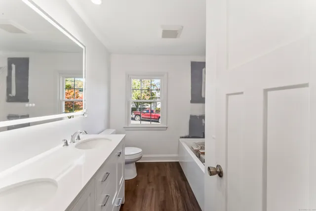 a bathroom with a sink a toilet and a bathtub