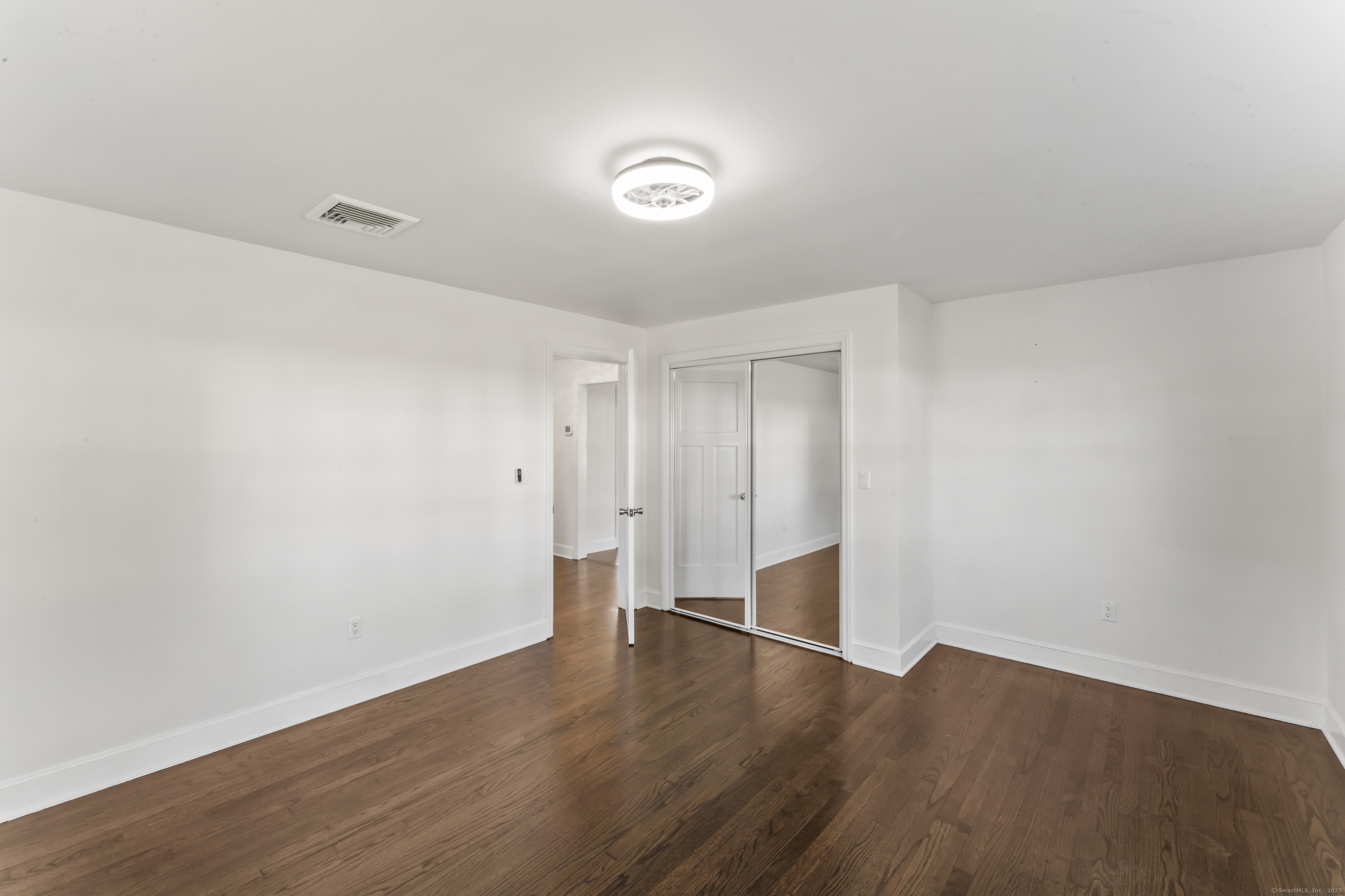 92 Feldspar Avenue Beacon Falls, CT 06403 - Photo 22 of 32 a view of an empty room with wooden floor
