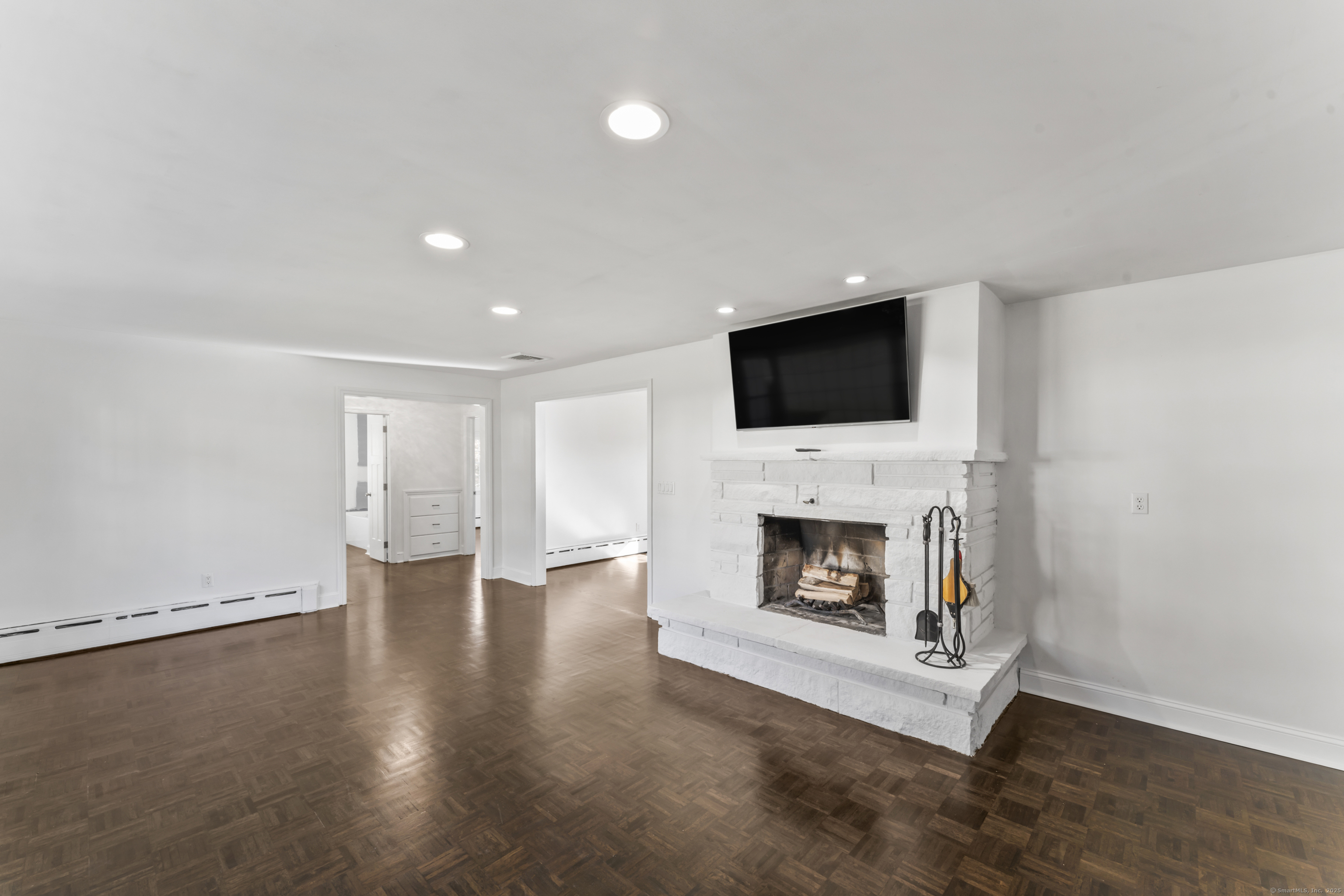 92 Feldspar Avenue Beacon Falls, CT 06403 - Photo 3 of 32 a living room with a fireplace and a flat screen tv