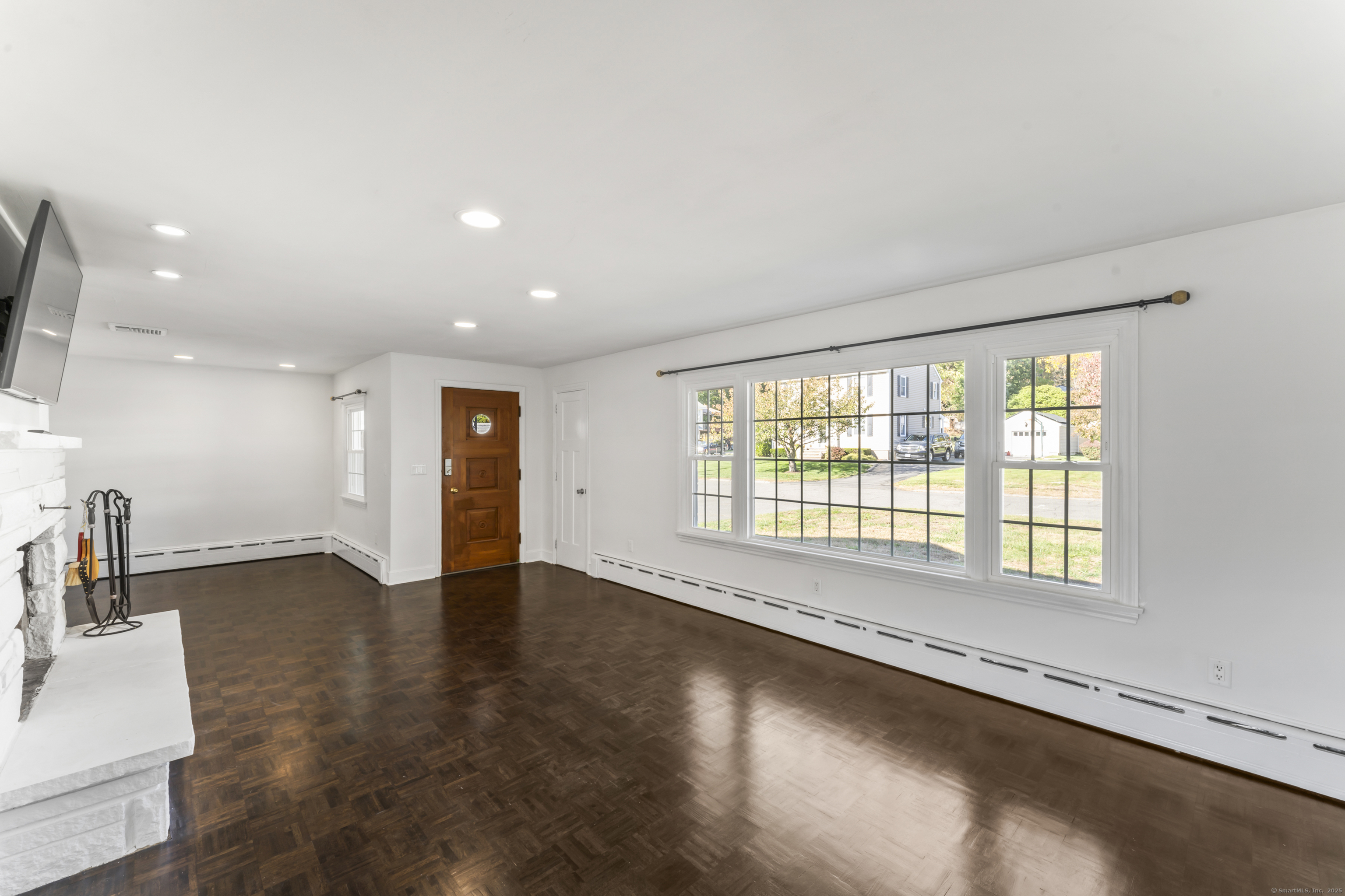 92 Feldspar Avenue Beacon Falls, CT 06403 - Photo 5 of 32 an empty room with wooden floor and windows