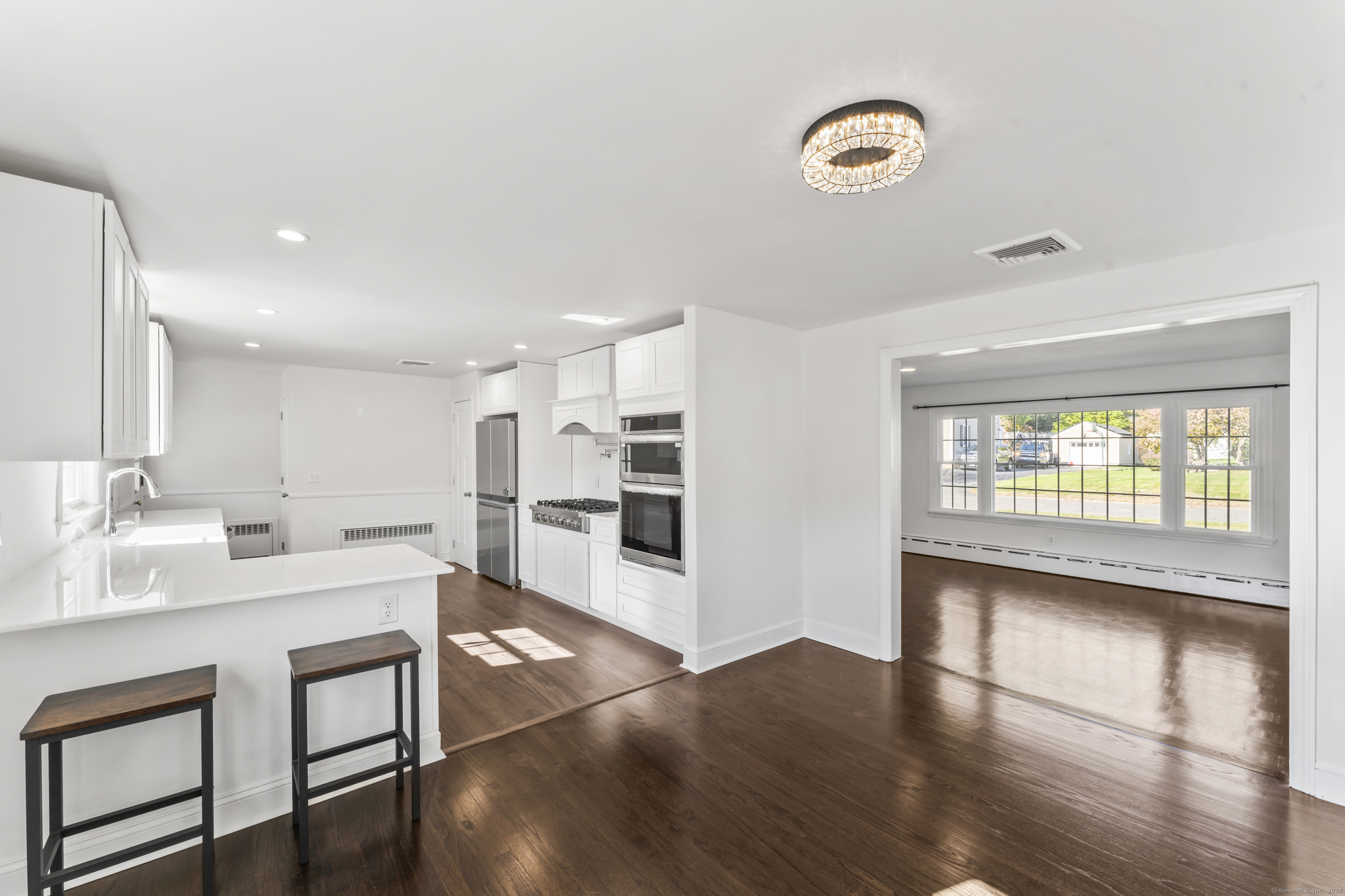 92 Feldspar Avenue Beacon Falls, CT 06403 - Photo 7 of 32 a large white kitchen with a window