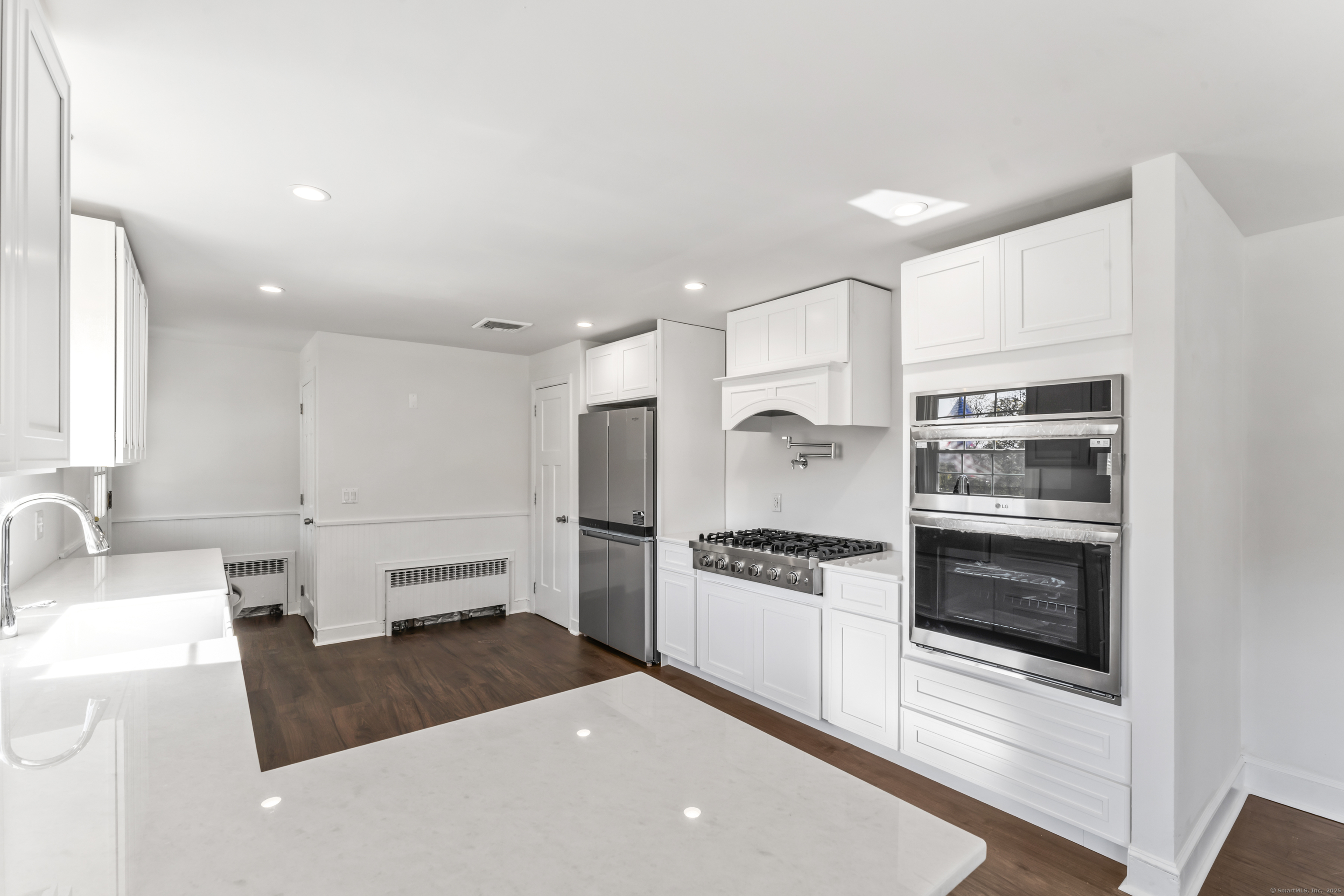 92 Feldspar Avenue Beacon Falls, CT 06403 - Photo 8 of 32 a kitchen with granite countertop a stove and a refrigerator