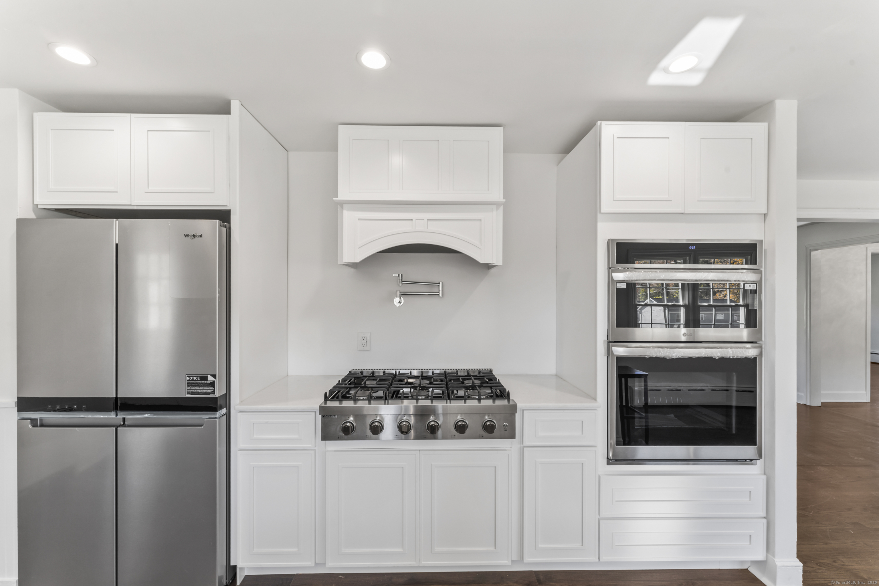 92 Feldspar Avenue Beacon Falls, CT 06403 - Photo 9 of 32 a kitchen with a refrigerator and a stove top oven