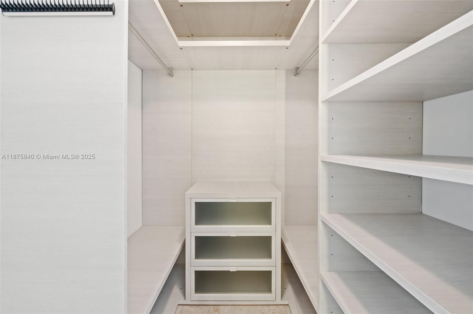 88 Southwest 7th Street, Unit 1403 Miami, FL 33130 - Photo 26 of 53 a view of an empty walk in closet