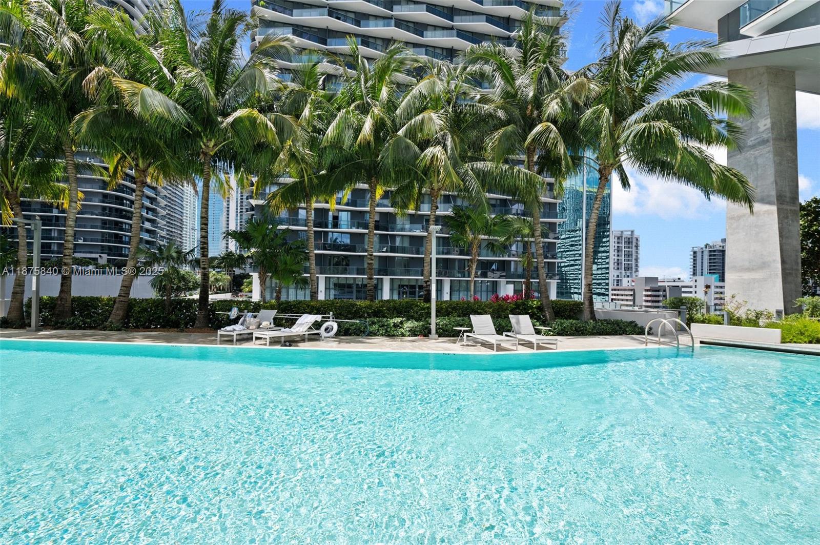 88 Southwest 7th Street, Unit 1403 Miami, FL 33130 - Photo 32 of 53 a view of a house with swimming pool and sitting area