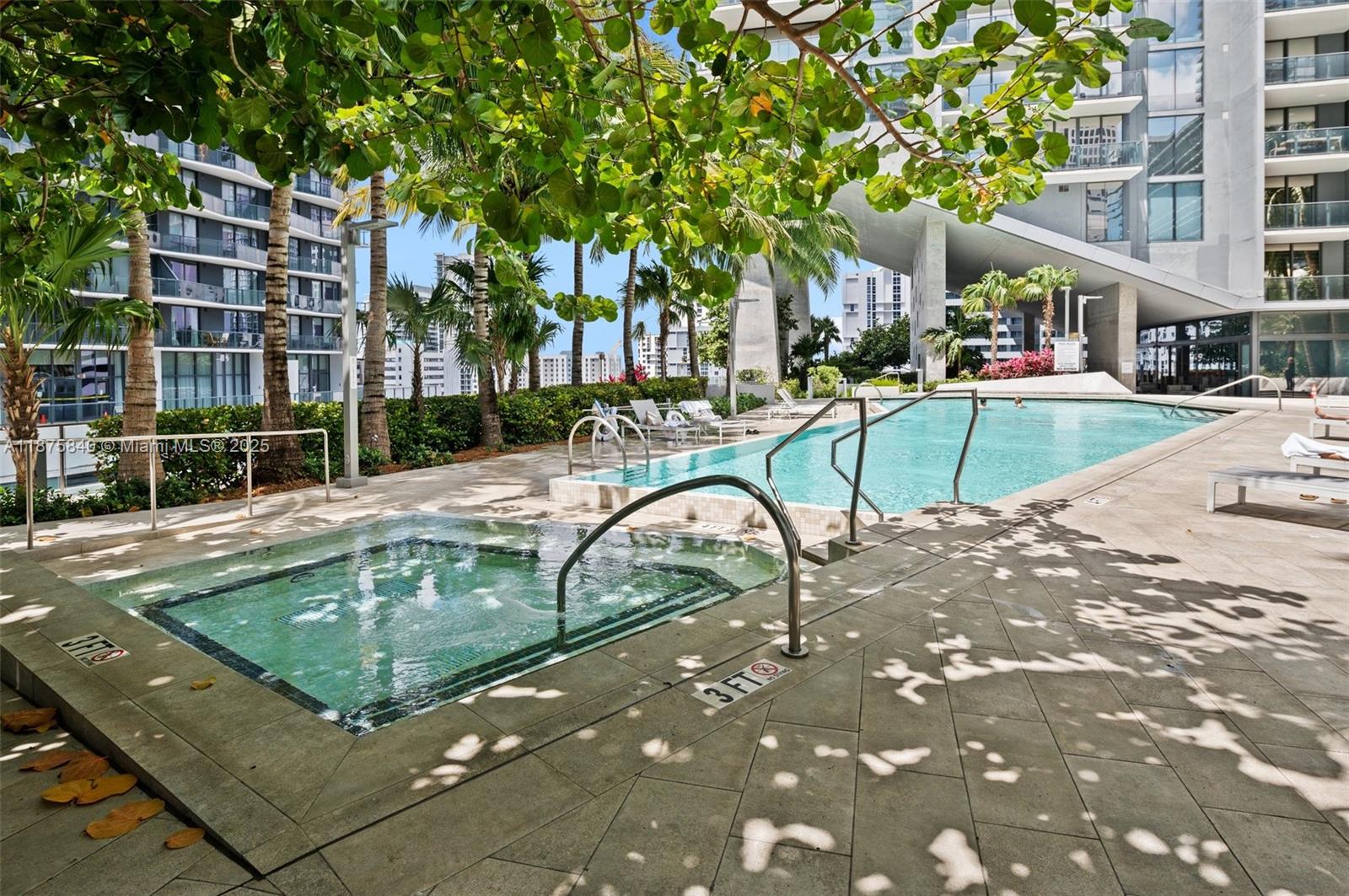 88 Southwest 7th Street, Unit 1403 Miami, FL 33130 - Photo 34 of 53 a view of a swimming pool with a patio