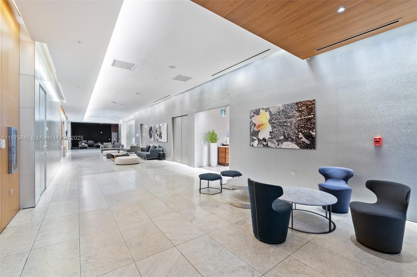 88 Southwest 7th Street, Unit 1403 Miami, FL 33130 - Photo 37 of 53 a living room with furniture and white walls