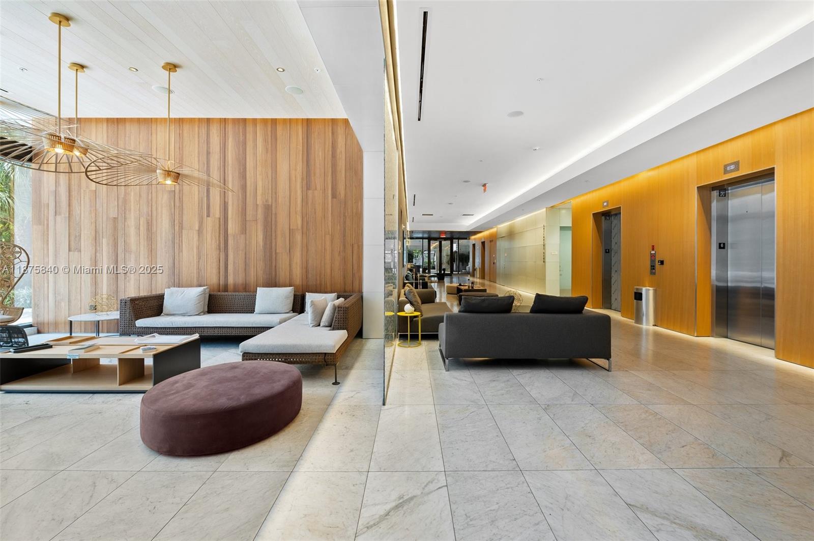 88 Southwest 7th Street, Unit 1403 Miami, FL 33130 - Photo 40 of 53 a living room with furniture and a chandelier