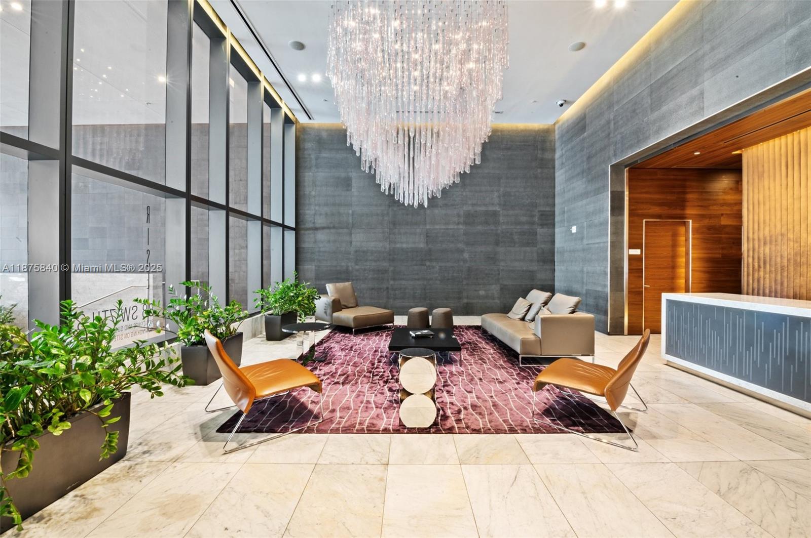 88 Southwest 7th Street, Unit 1403 Miami, FL 33130 - Photo 4 of 53 a view of a chairs in back yard of the building