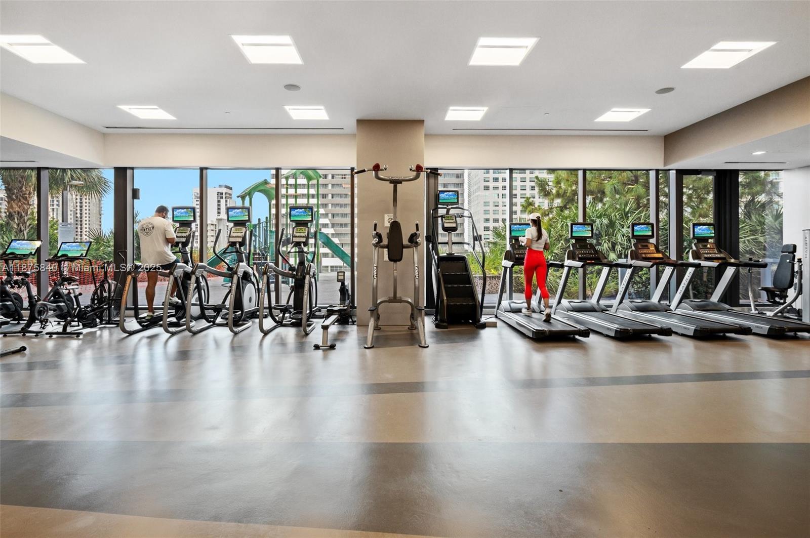 88 Southwest 7th Street, Unit 1403 Miami, FL 33130 - Photo 43 of 53 a view of a room with gym equipment