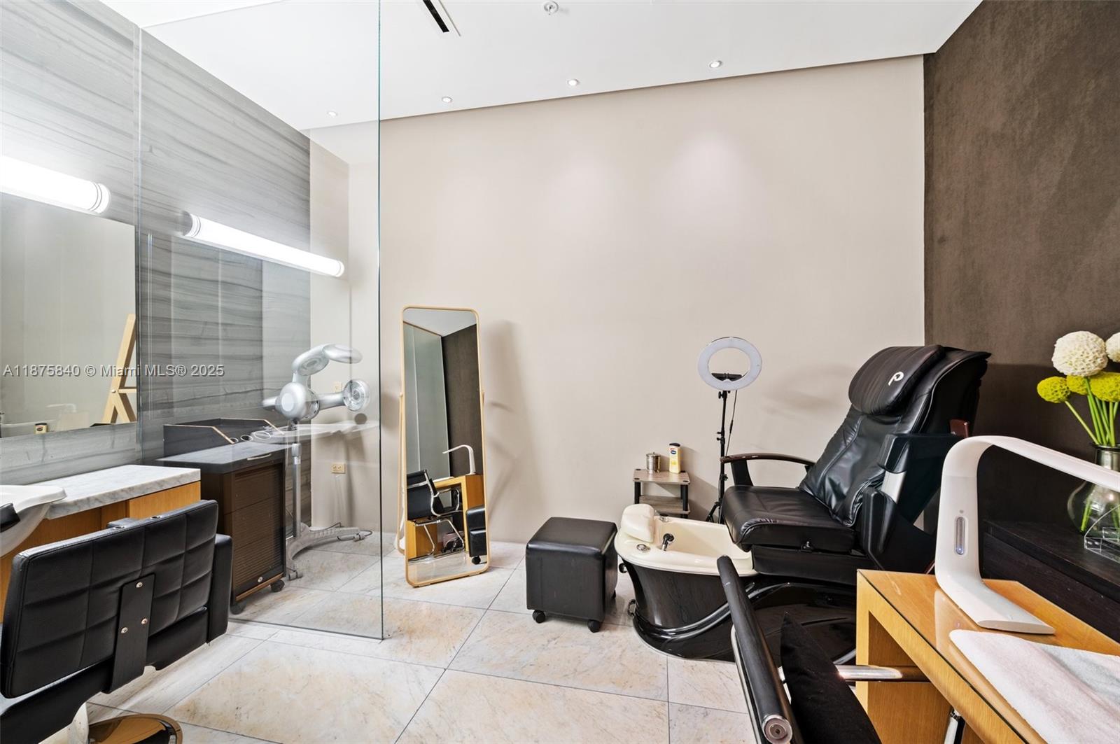 88 Southwest 7th Street, Unit 1403 Miami, FL 33130 - Photo 44 of 53 a view of a workspace with furniture and gym equipment