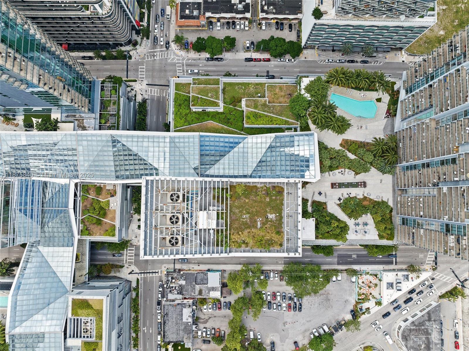 88 Southwest 7th Street, Unit 1403 Miami, FL 33130 - Photo 48 of 53 an aerial view of houses with a swimming pool