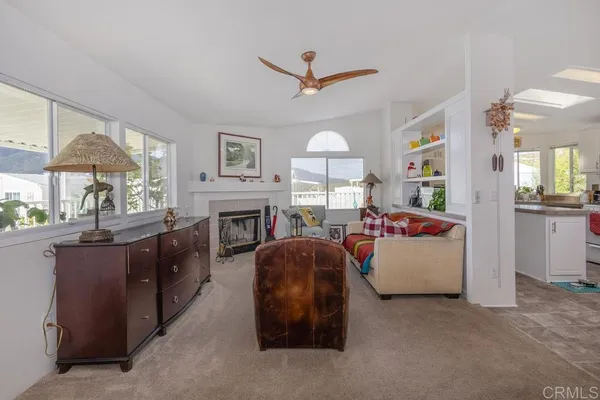 a kitchen with stainless steel appliances granite countertop a refrigerator sink stove and cabinets