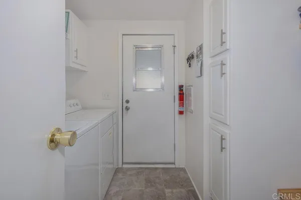 a bedroom with a bed and chair