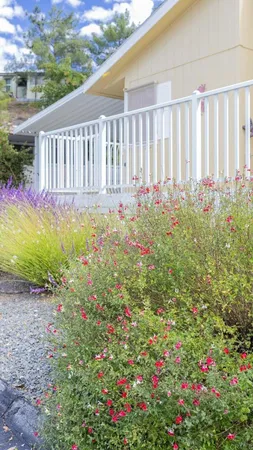 a view of swimming pool with outdoor seating and lake view