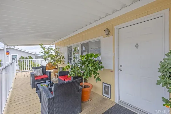 a living room with fireplace furniture and a dining table