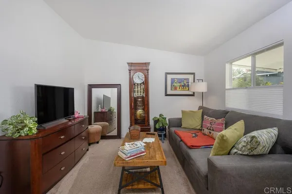 a kitchen with stainless steel appliances granite countertop a sink and a refrigerator