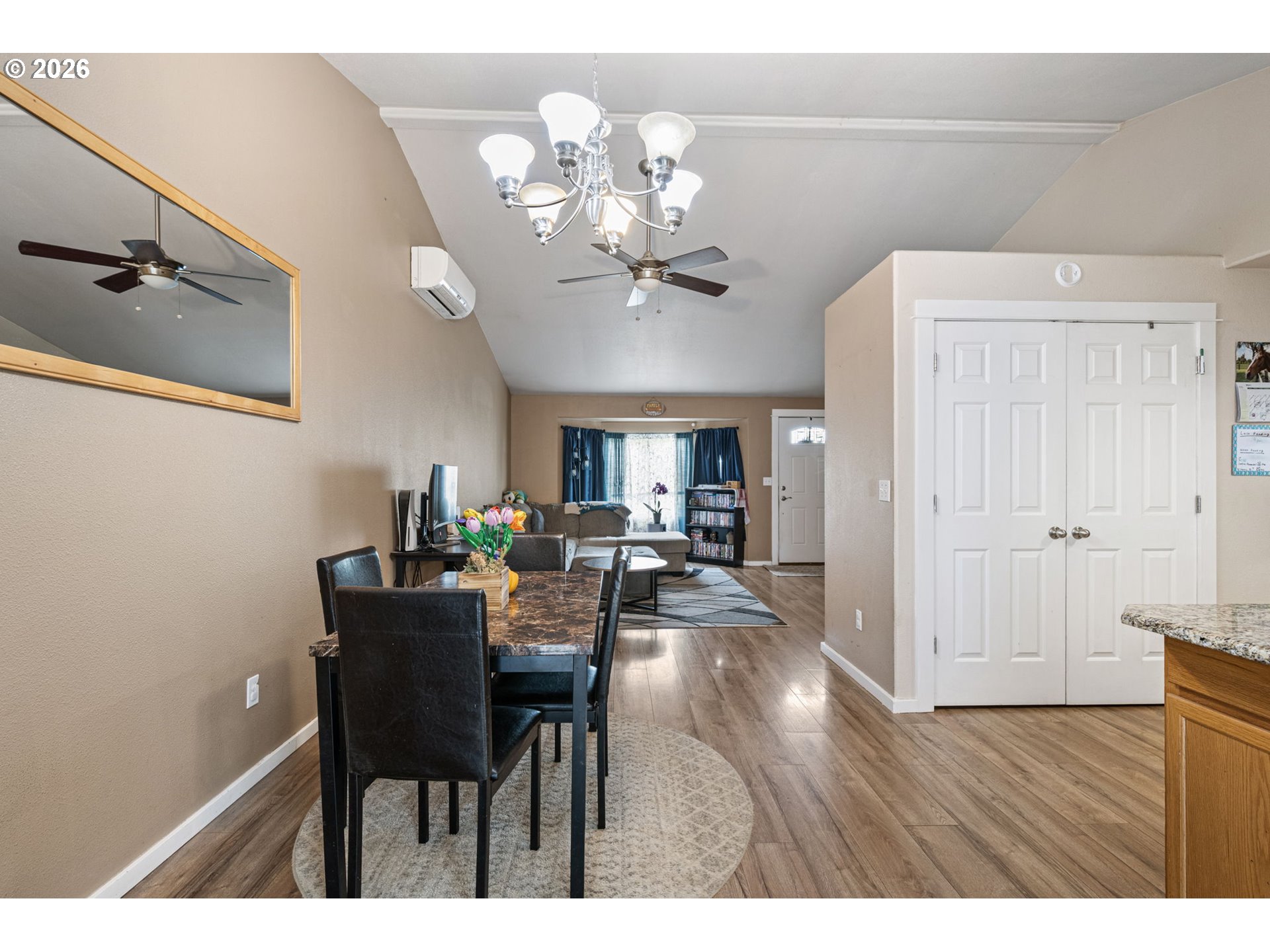 1055 Ash Grove Loop Creswell, OR 97426 - Photo 15 of 33 a view of a dining room with furniture and chandelier